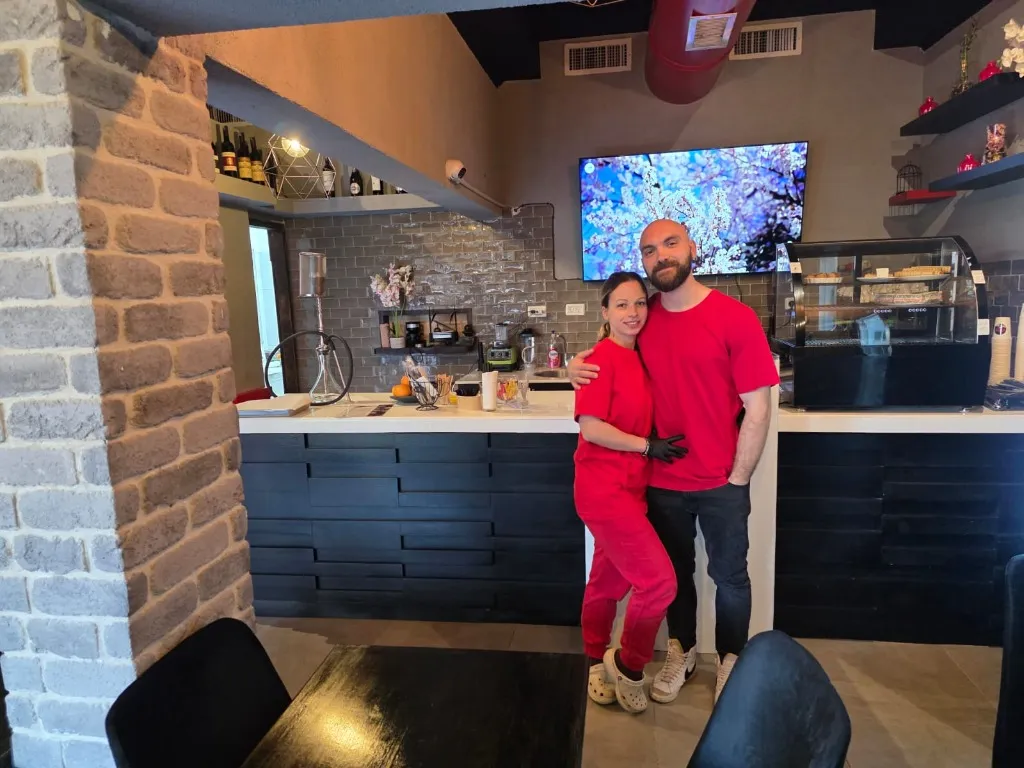 Owners behind the counter in Elenor Cafe